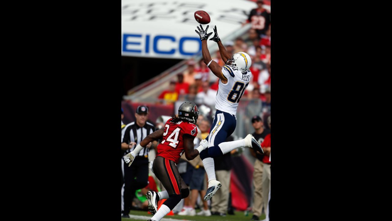 San Diego receiver Malcom Floyd of the San Diego Chargers catches a pass in front of Tampa Bay safety Mark Barron during the game at Raymond James Stadium on Sunday in Tampa, Florida.