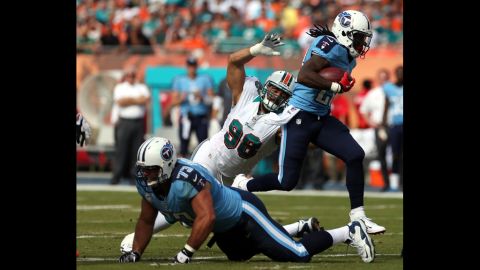 Running back Chris Johnson of the Titans runs against the Dolphins on Sunday.