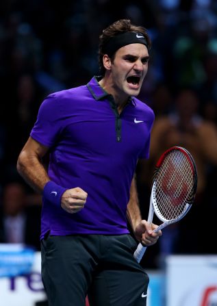 Defending champion Roger Federer celebrates after beating home hope Andy Murray at the ATP World Tour Finals on Sunday.