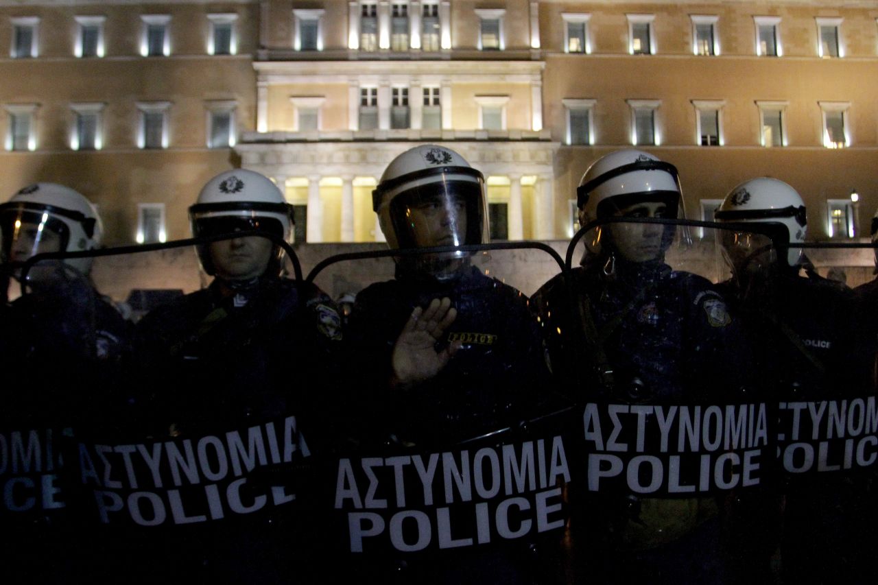 Riot police guard the Parliament building during a demonstration against austerity measures as Greek deputies consider a budget vote on November 11, 2012.