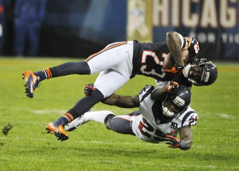 Devin Hester of the Bears is tackled by Kareem Jackson of the Texans on Sunday.