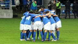 The Real Oviedo team huddle on the pitch before taking on Real Madrid's reserve team in Oviedo