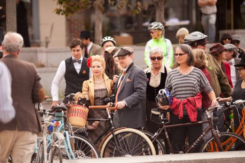 People gather in downtown Decatur before setting off to ride, including Jae Schmidt, pictured with hat, the owner of Houndstooth Road bicycle boutique, who helped organize the event.