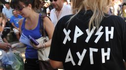 Members of the far right Golden Dawn party distibute food to Greeks only, checking their IDs, in Patras on October 6, 2012.