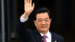 Chinese President Hu Jintao waves as he arrives to attend an APEC summit in the Russian city of Vladivostok on September 8, 2012.