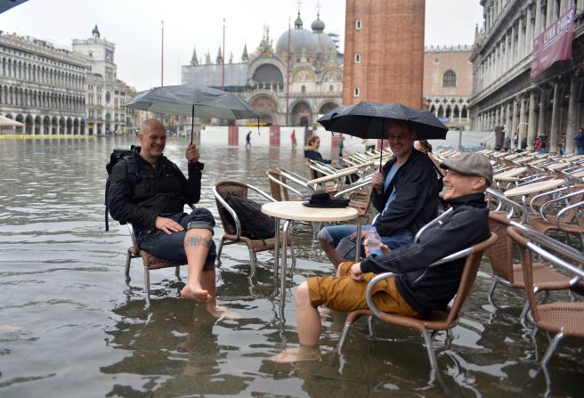 The city's famed St Mark's Square was left under several feet of water -- but some visitors were determined to enjoy the view, whatever the weather.
