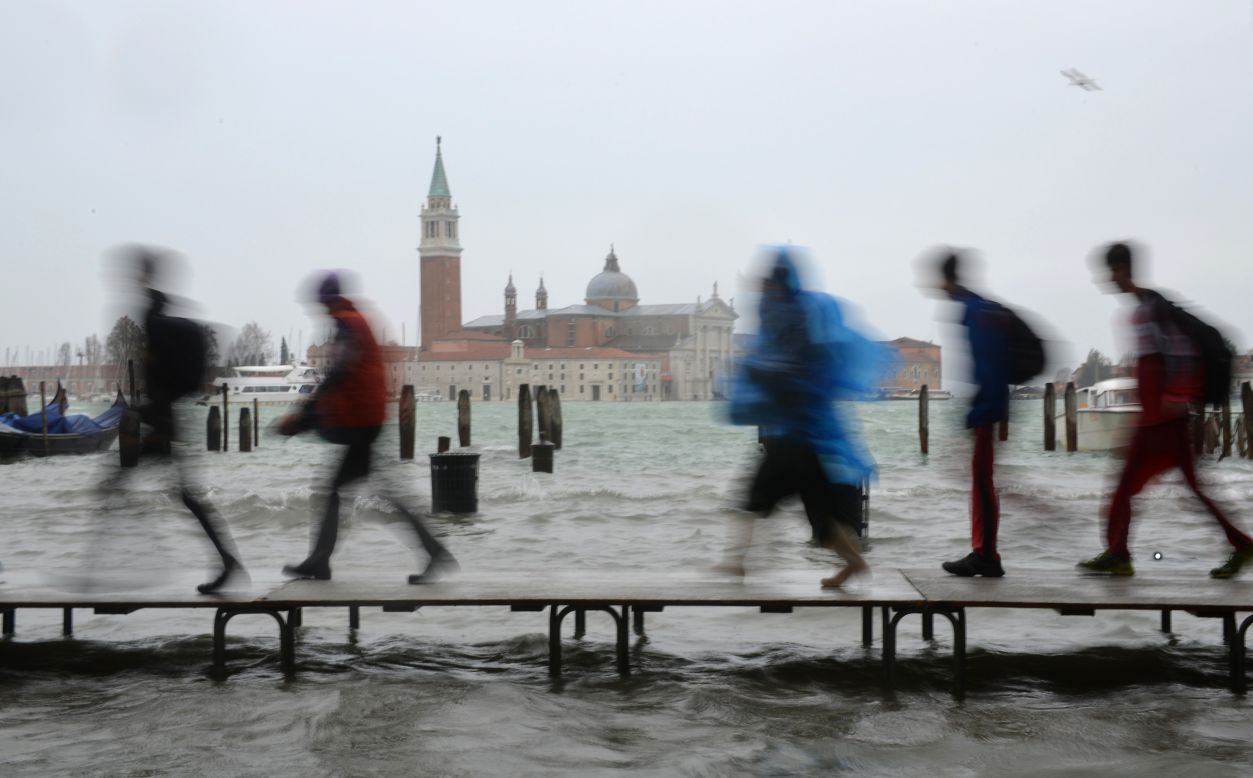 Heavy rain and high winds combined with seasonal high tides have caused floods in parts of northern Italy. 