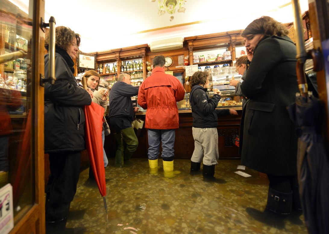 Others donned rubber boots for a visit to one of the city's cafes.