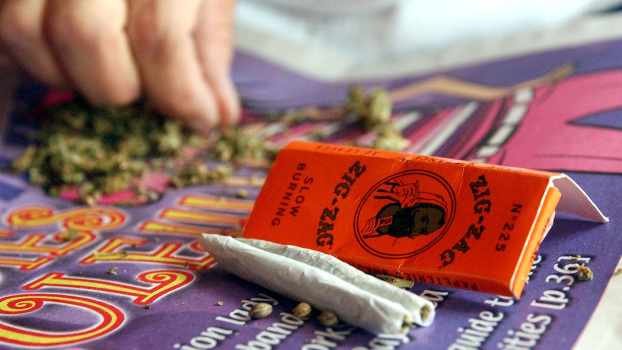 A woman hand rolls joints in San Francisco for a medical cannabis cooperative. Colorado and Washington state legalized recreational marijuana on November 6.