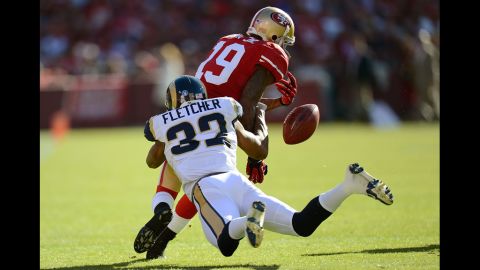 Ted Ginn Jr. of the 49ers, returning a kickoff, has the ball stripped away by Bradley Fletcher of the Rams during the first quarter on Sunday.