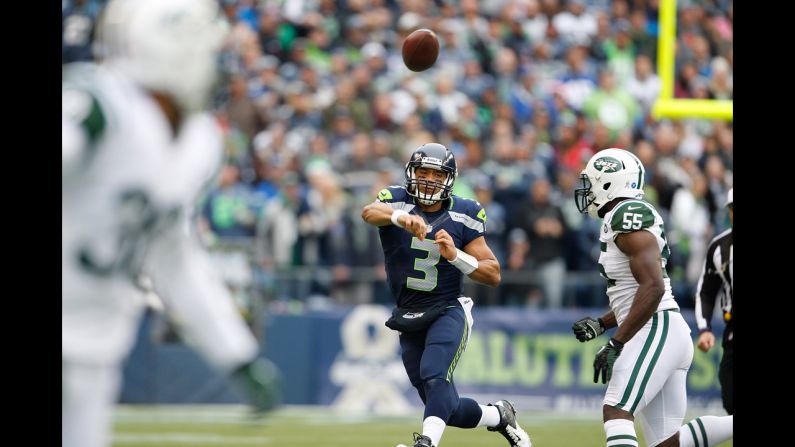 Quarterback Russell Wilson of the Seattle Seahawks throws in the first half against the New York Jets at CenturyLink Field on Sunday in Seattle. Seattle defeated the New York Jets 28-7.