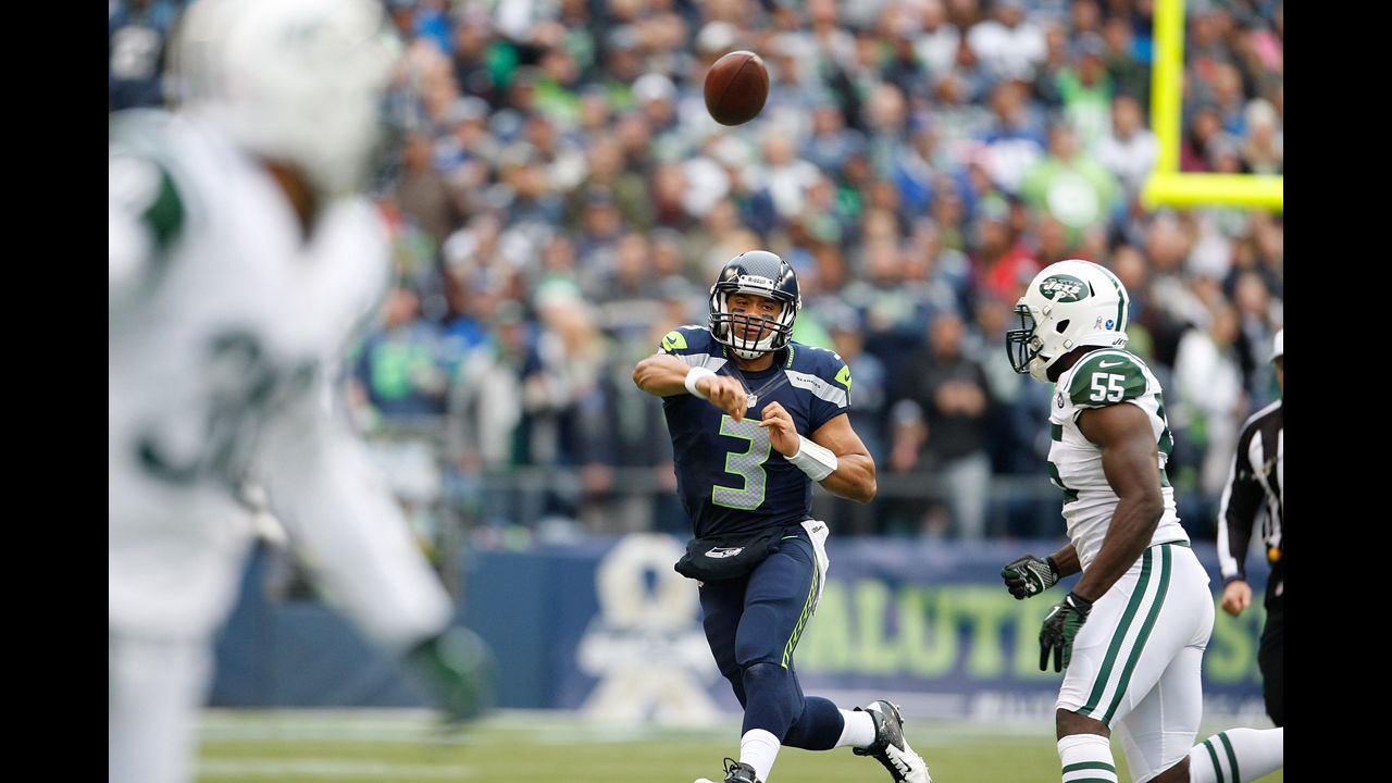 Quarterback Russell Wilson of the Seattle Seahawks throws in the first half against the New York Jets at CenturyLink Field on Sunday in Seattle. Seattle defeated the New York Jets 28-7.  
