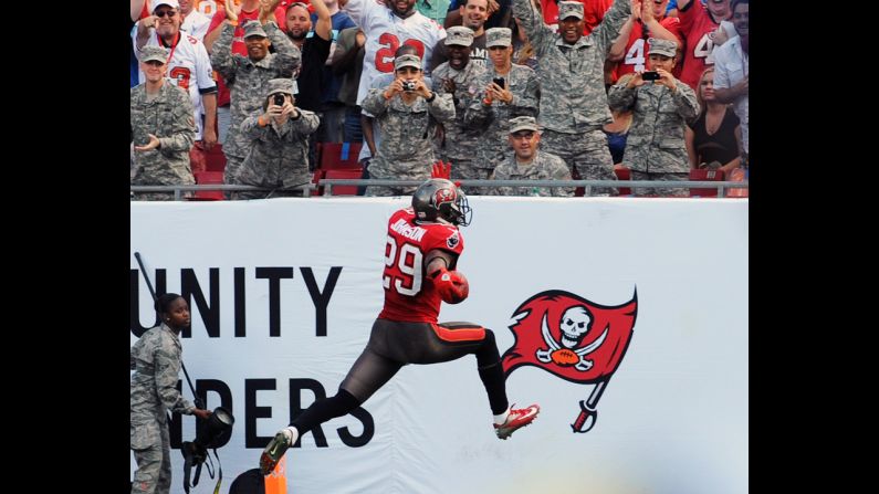 Tampa Bay cornerback Leonard Johnson runs 83 yards with a pass interception for a touchdown against the San Diego Chargers on Sunday.