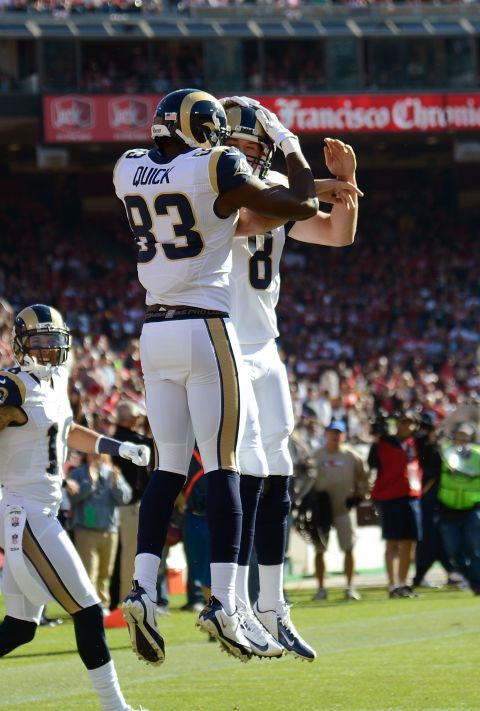 Brian Quick and Sam Bradford of the Rams celebrate after Quick scored on a 35-yard pass play against the 49ers in the first quarter on Sunday.