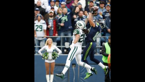 Cornerback Kyle Wilson of the Jets reaches to stop wide receiver Golden Tate of the Seahawks from making a touchdown catch in the first quarter on Sunday.