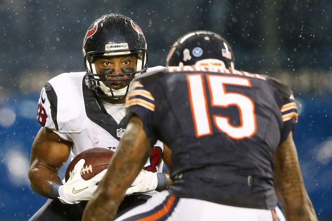 Free safety Danieal Manning of the Houston Texans carries the ball against wide receiver Brandon Marshall of the Chicago Bears at Soldier Field on Sunday in Chicago.
