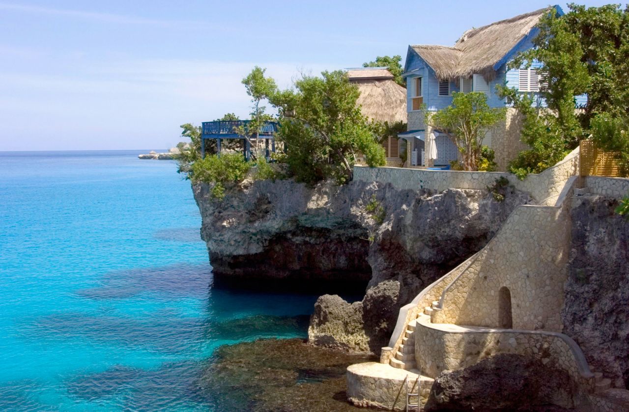 The 12 villas at The Caves are built into the rock shelf with expansive views over the impossibly blue Caribbean Sea.