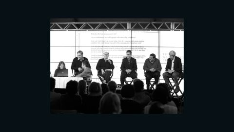 Carly Fleischmann sits on a panel to discuss technology and autism with Sen. John Kerry.