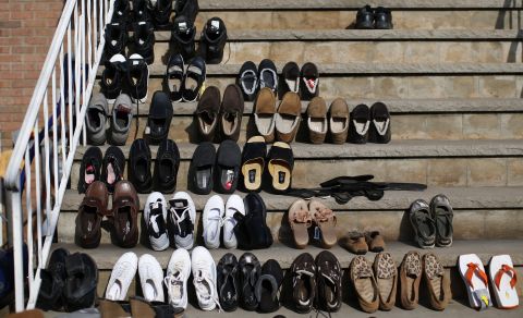 Shoes are set out to dry Monday on the steps of a house in an area that was completely flooded on the south side of Staten Island in New York City.