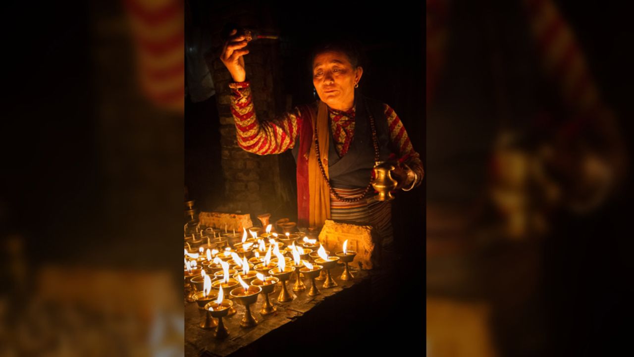 <a href="http://ireport.cnn.com/people/TravelinRav">Stephen Ravndal</a> of Boston, Massachusetts, took this photo of a woman lighting a candle to mark the beginning of Diwali whilst wandering the backstreets of Boudnath, Nepal. "The woman's attention to detail and devotion are plainly obvious and the lights, which are such an integral part of the festival, really capture a warm and serene mood," he says.