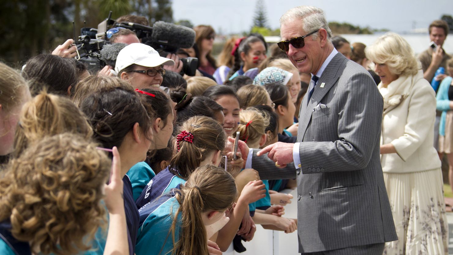 Britain's Prince Charles and his wife Camilla greet well-wishers in Auckland on Monday.