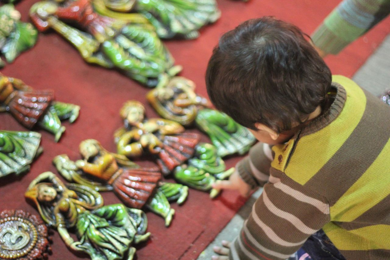 <a href="http://ireport.cnn.com/people/manishkanoji">Manish Kanojia</a> took this image of his daughter, Kyra, reaching out to touch ceramic artifacts on sale at a market in New Delhi, India. The ornamental items are a popular buy around Diwali time when "people use them to decorate their homes," he says.
