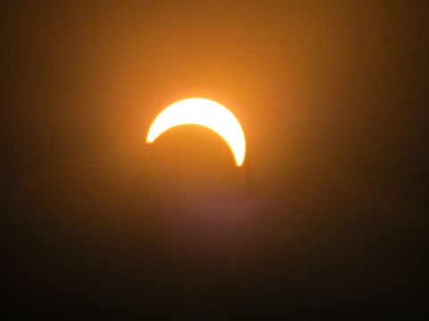 "I thought it would be cool to take a few photos because I haven't seen an eclipse in my lifetime, says iReporter <a href="http://ireport.cnn.com/people/sjhill87">Samuel Hill</a> who shot this picture in Wellington, New Zealand. "Most people were really excited once they got to look through the solar lenses to see the eclipse."