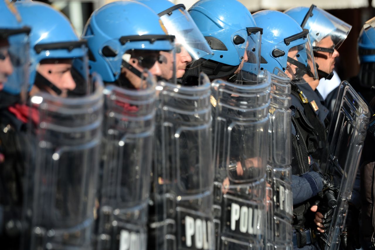 Riot policemen stand in line in Rome. 