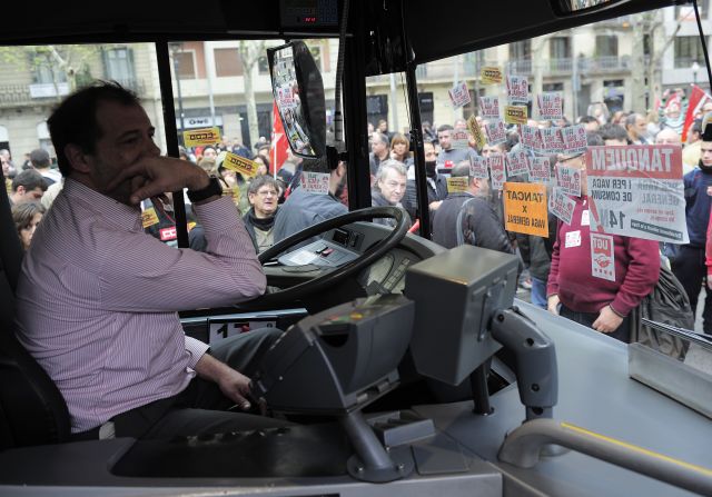 Demonstrators block a bus in Barcelona.