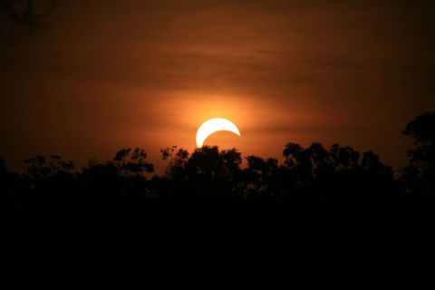 <a href="http://ireport.cnn.com/people/Stitchum">Sandra Otto</a> took this photo from the side of the road in the northern suburbs of Darwin, Australia, after forgetting about the eclipse until it was about to happen. "I quickly got my camera and my bigger lens and jumped into my utility," she says. " I wish I was better prepared but found it to be a truly amazing experience, spectacular." 