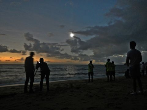iReporter <a href="http://ireport.cnn.com/docs/DOC-881111">David Brungger</a> was one of many people to witness the eclipse at Palm Cove in the north of Queensland. "When everything finally went almost totally dark, some people were clapping, some people were cheering with joy, and we all took our eclipse glasses off to enjoy some of the most exciting and beautiful seconds of my life. Too bad it only lasted roughly one minute," he says. 