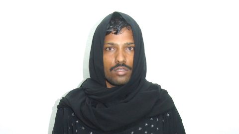 A mug shot of a man who dressed like a woman to sneak into a ladies only park in the UAE.