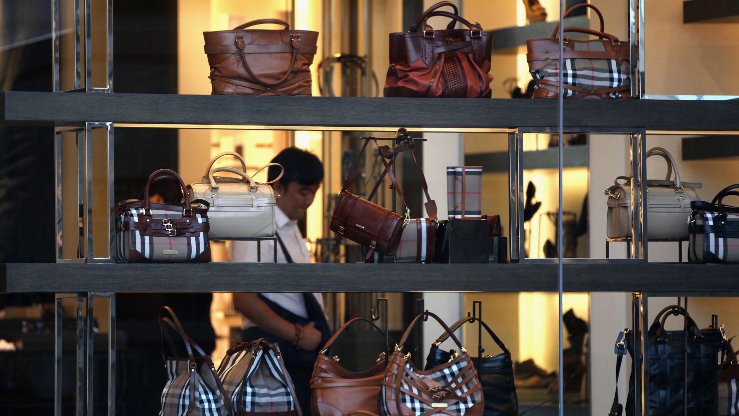 A Chinese consumer browses the Burberry flagship store in Beijing. 