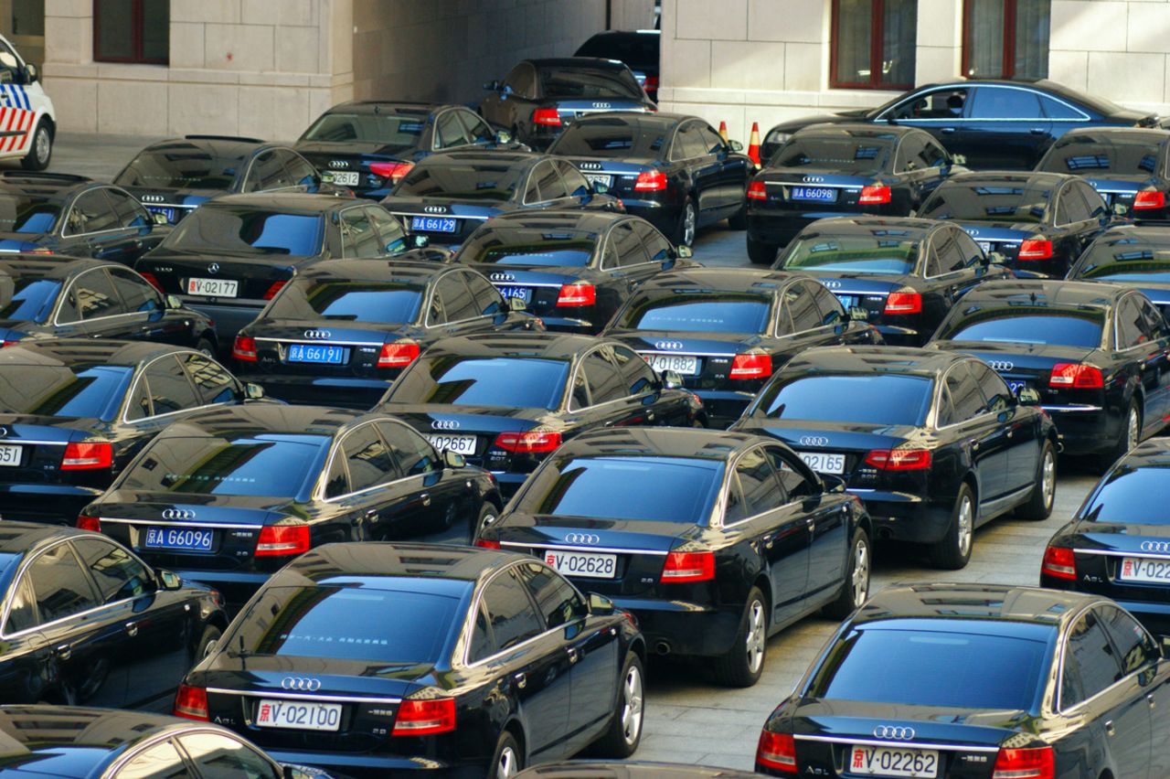 Cars for delegates to the party congress are pictured near the Great Hall of the People, mostly black Audis.