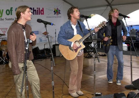Isaac, Taylor and Zac Hanson of Hanson perform in 2001. The brothers became superstars with their 1997 album "Middle of Nowhere" thanks to a little earworm called "MMMBop."