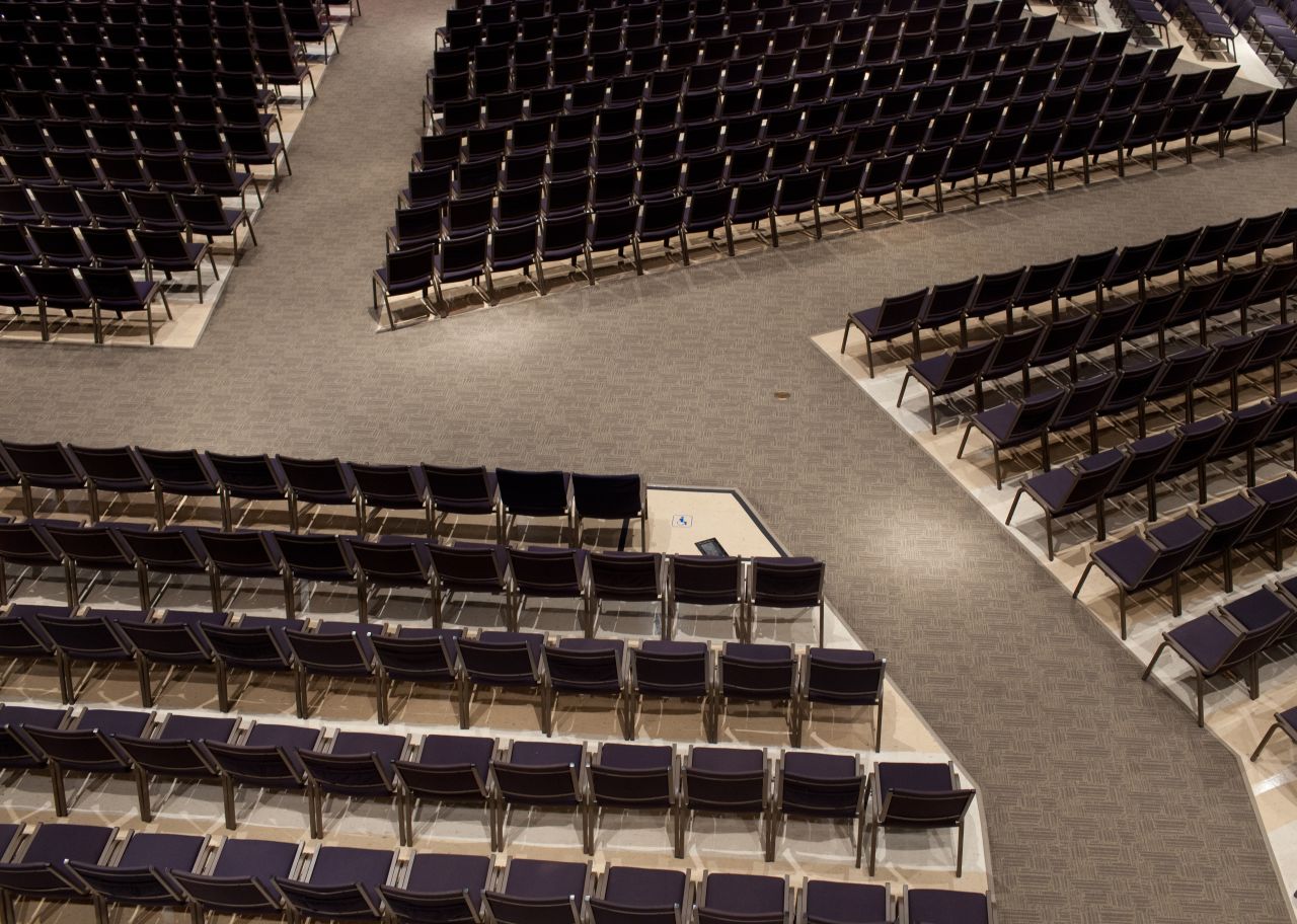 Chairs fill the large main sanctuary at North Point Community Church, where Andy Stanley is the senior pastor. The church helped pioneer a new way of worshipping that used contemporary Christian music, stage lights, video skits and visual props during sermons.