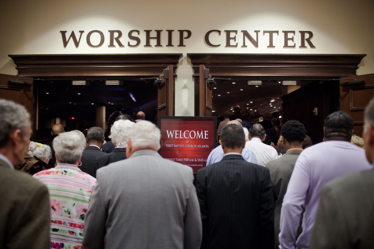 Churchgoers wait outside the entrance to First Baptist Church Atlanta on a recent Sunday morning. Service began at 9 a.m. but people began lining up at 7:30 a.m. The church is Southern Baptist but its appeal transcends denominational and racial lines.