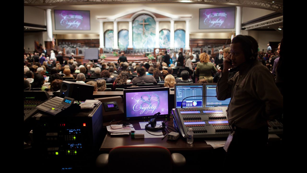 A technician at First Baptist Church Atlanta prepares to celebrate the 80th birthday of Charles Stanley, the church's senior pastor. Stanley was a church innovator, one of the first pastors to install an orchestra in a church. His embrace of technology helped spread his reputation.