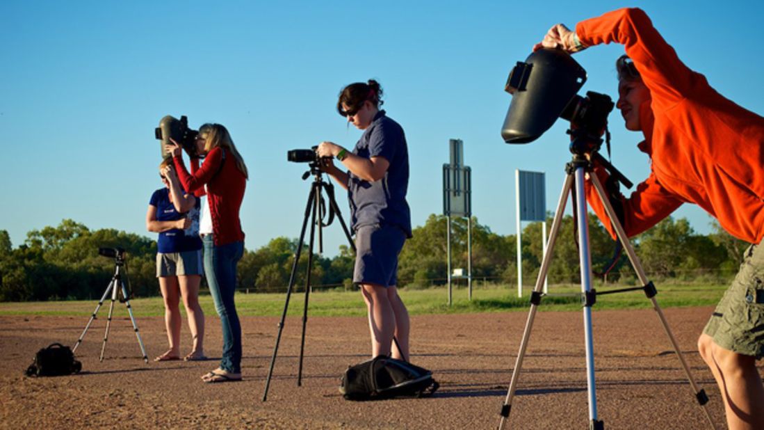 <a href="http://www.flickr.com/photos/8547591@N08/" target="_blank" target="_blank">David Freeman</a> of Longreach in outback Queensland sent in this image of photographers prepping for the big moment. "Even if we didn't get totality the light was really interesting," he says. "Coming so close after sunrise we had the typical outback orange and red sunrise and then went into an almost surreal subdued light. Not the same colors as a normal sunrise but definitely not normal daylight either."