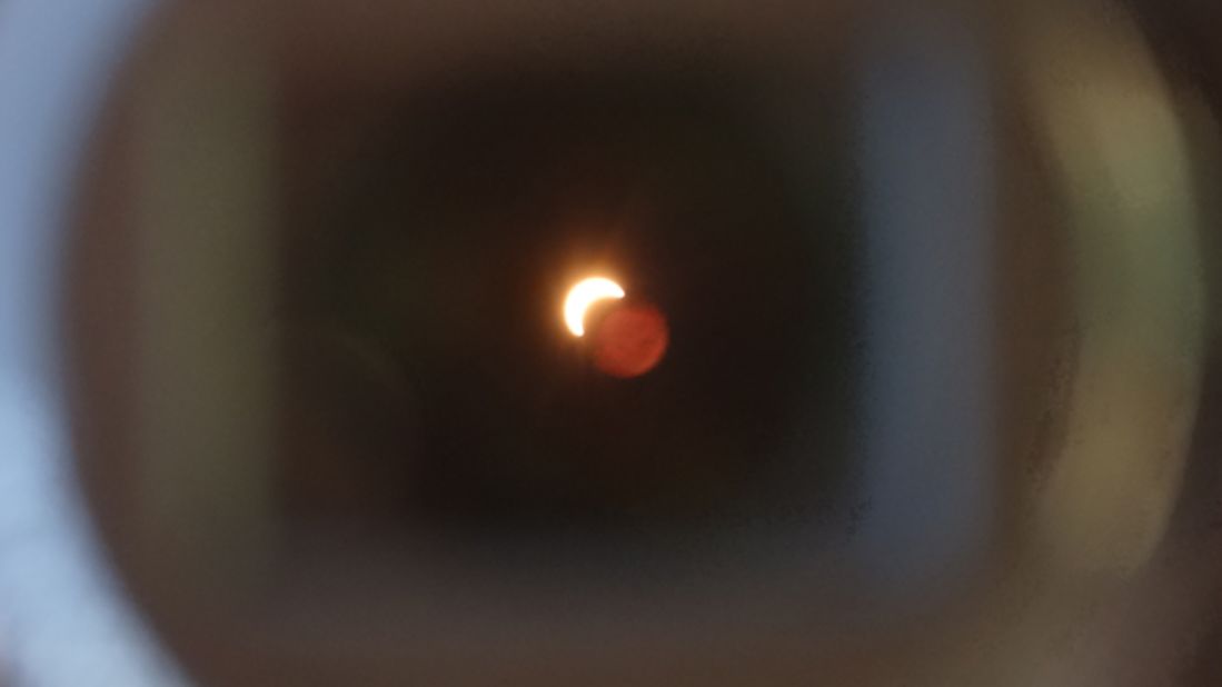 <a href="http://ireport.cnn.com/people/sjsoon">Alistair Soon</a> snapped this image as the eclipse passed over his home city of Brisbane early Wednesday morning. "It is amazing just with a solar filter, one could see that the moon is just right there in front of the sun," he says.