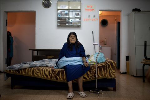 A woman sits inside a bomb shelter Wednesday, November 14, in Netivot, Israel.