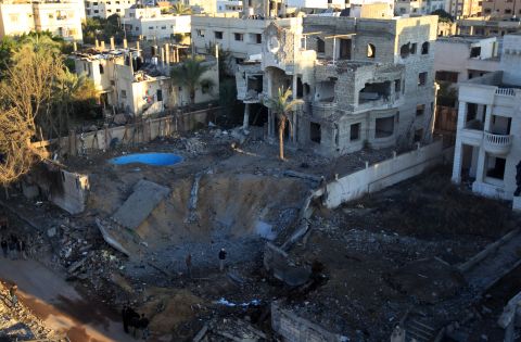 A crater is left at a spot targeted by an Israeli airstrike in Gaza City early Thursday, November 15.