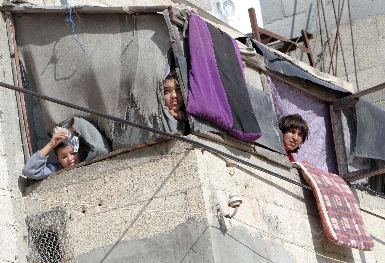 Palestinians watch a funeral Thursday, November 15, in southern Gaza. 