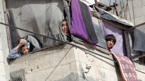 Palestinians watch a funeral Thursday, November 15, in southern Gaza.