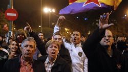 Protesters attend a demonstration organized by Spain's "indignant" protesters, a popular movement against a political system that they say deprives ordinary Spaniards of a voice in the crisis, near the parliament building in Madrid during a general strike. The second general strike this year hit Spain with protesters marching in several cities against sweeping austerity measures and high unemployment, scenes echoed elsewhere in Europe. Spain, the eurozone's fourth-biggest economy, is suffering 25 percent unemployment, with the rate even higher amongst young people. AFP PHOTO / CESAR MANSO        (Photo credit should read CESAR MANSO/AFP/Getty Images)