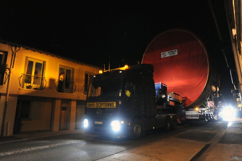 Every fortnight, the giant components of the Airbus A380 are hauled through the narrow streets of Levignac, southern France. 