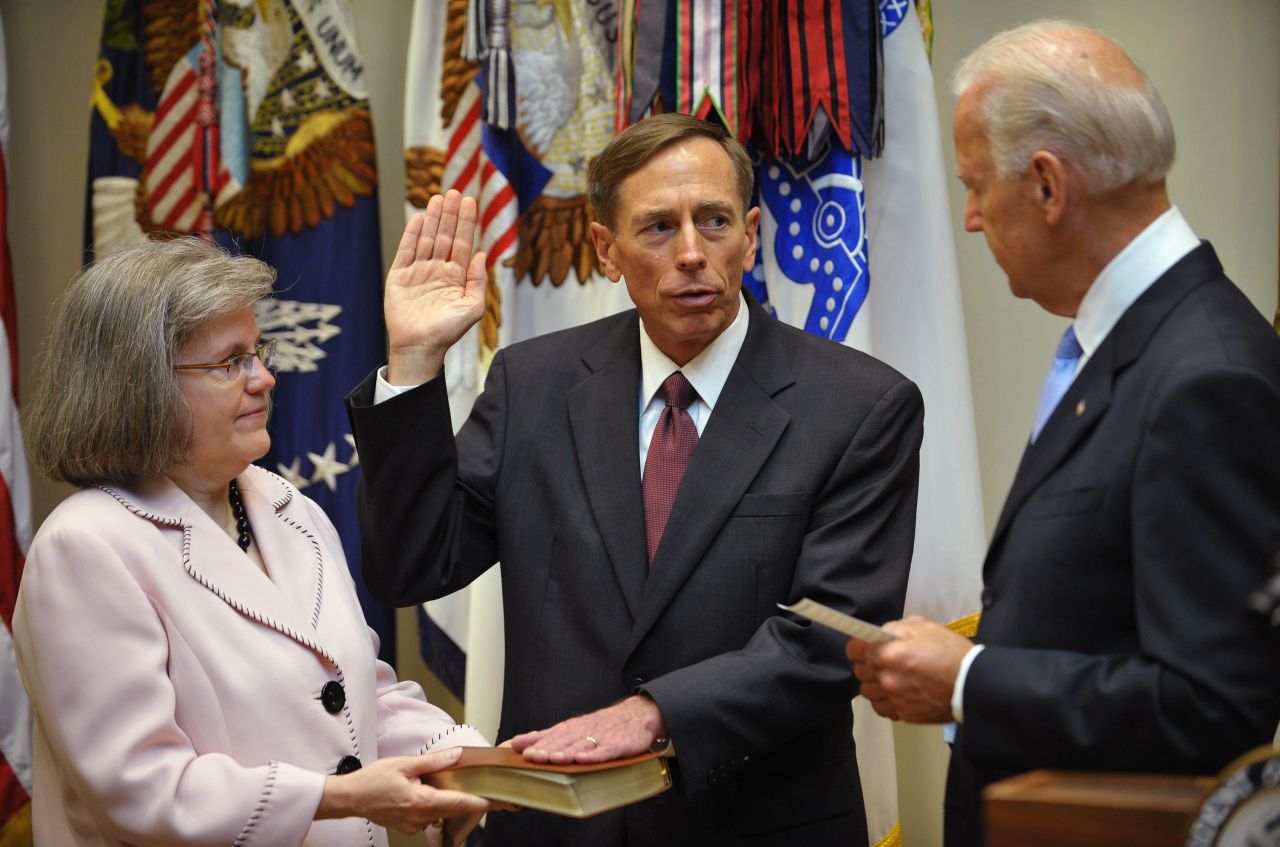 Petraeus takes the oath of office as the next director of the Central Intelligence Agency from Vice President Joe Biden as Petraeus' wife Holly looks on in September 2011 in the Roosevelt Room of the White House.