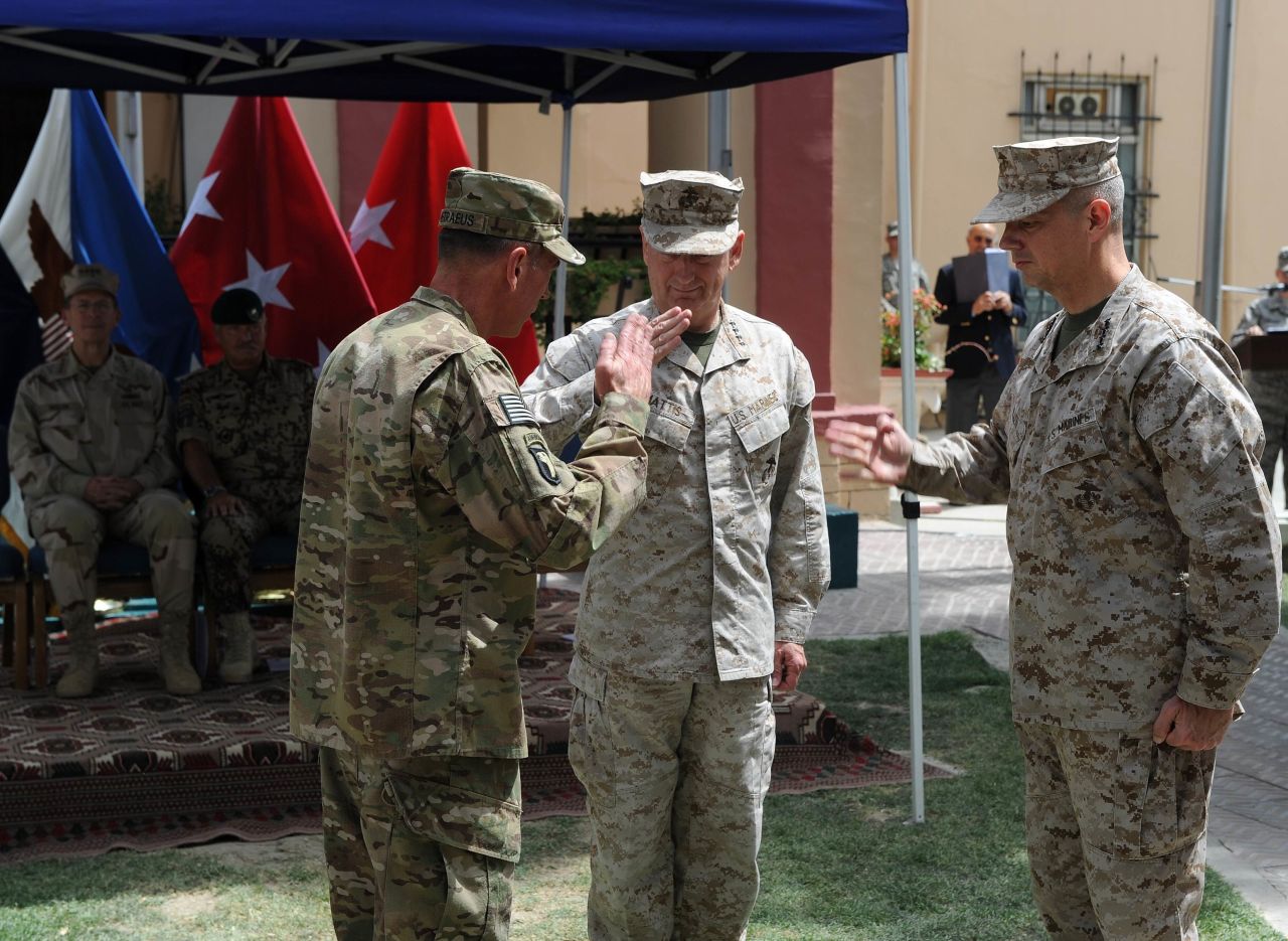 Petraeus, left, salutes his replacement as leader of the Afghanistan war, Gen. John Allen, right, and Gen. James Mattis during a change of command ceremony in Kabul, July 2011.