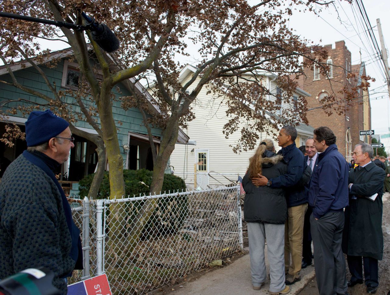 President Barack Obama embraces a local resident on Cedar Grove Avenue during a visit to Staten Island on Thursday, November 15.