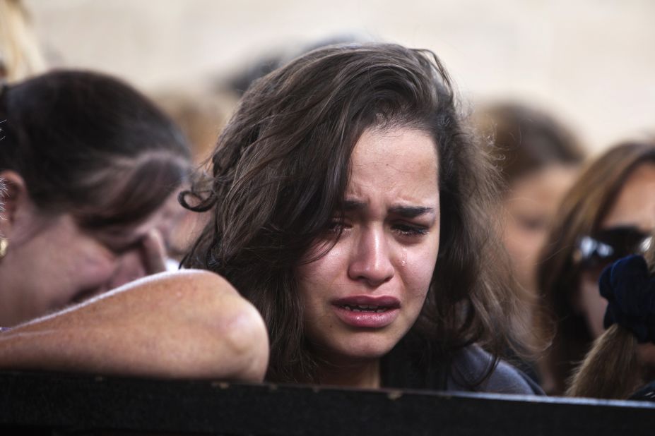 A woman cries during the funeral of Itzik Amsalam on Friday, November 16.
